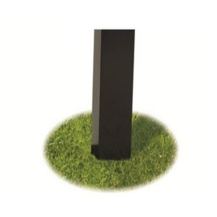 Black rectangular object on a grassy patch with a white background