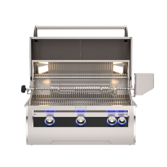 Stainless steel grill with four control knobs on a white background